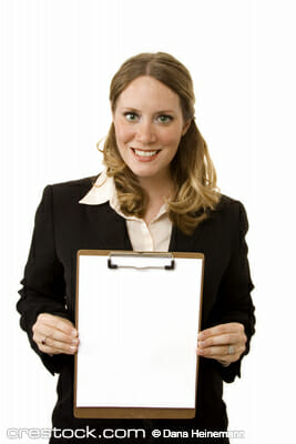 Businesswoman on white holding a clipboard wit...